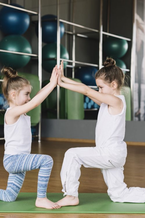 two-girl-child-exercising-together-gym